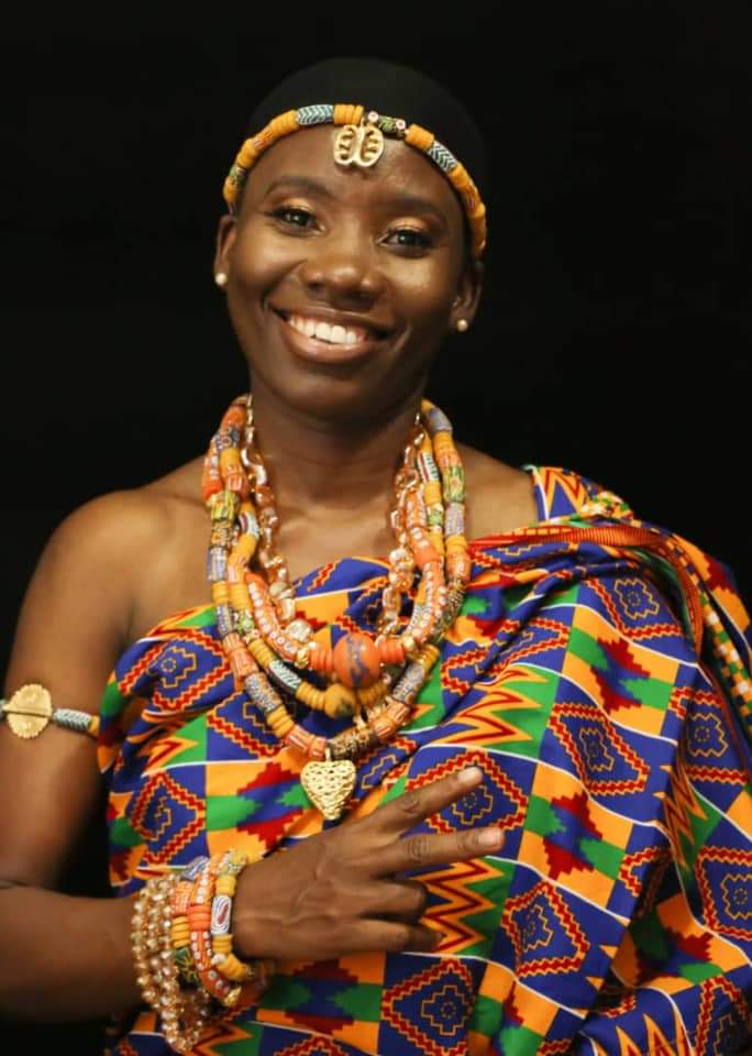 Playful Ghanaian Woman in Vibrant Kente Cloth Dress - Cultural